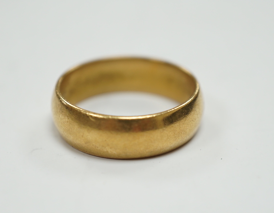 A 1960's 22ct gold wedding band, size M, 6 grams.